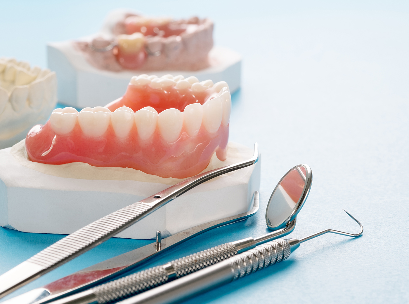 Complete denture or full denture on blue background