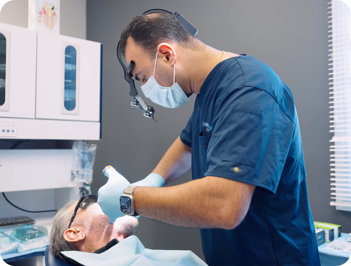 Dr Rand Luka placing dental implants