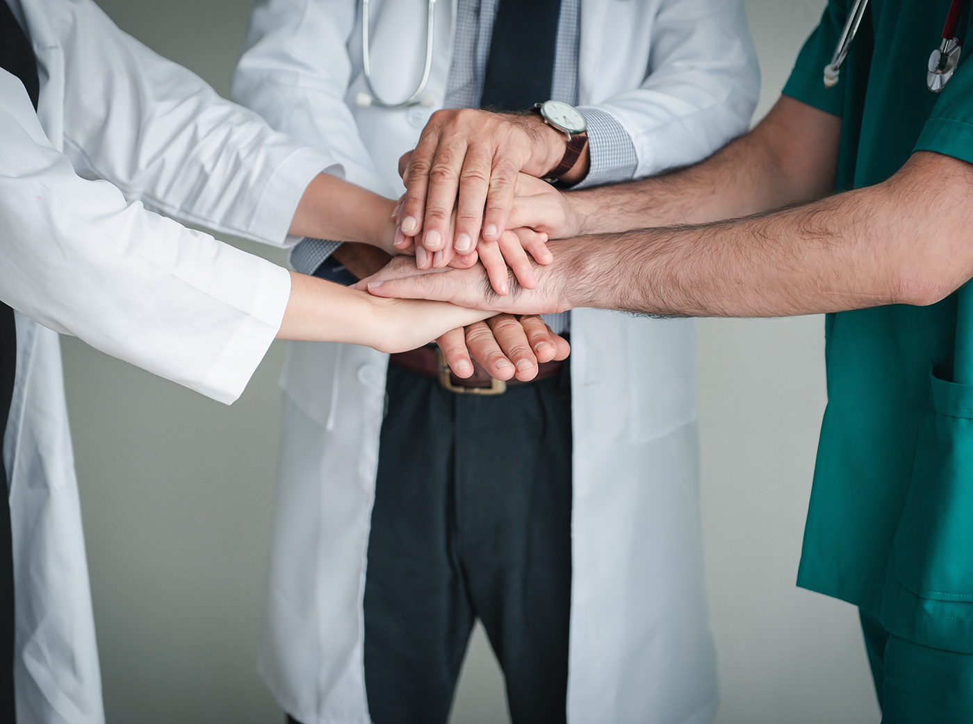 Medical Dentist Team Stacking Their Hands Together