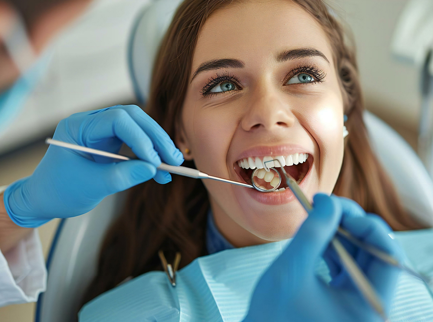 Woman receiving dental check-up from professional dentist with clean white teeth