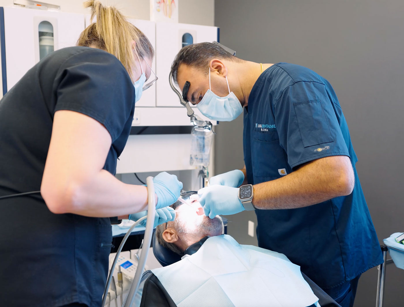 Dr Luka placing implants on a patient in London, Ontario